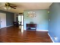 Inviting living room featuring hardwood floors, dining area access, and modern wall decor at 1958 19Th Avenue Ne Dr # 8, Hickory, NC 28601