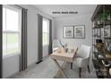 Cozy office space with natural light, modern desk, and built-in shelving for storage at 217 Basildon St # 1018, Lancaster, SC 29720