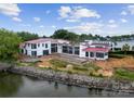 Exterior view of a modern home under construction near the water at 22554 John Gamble Rd, Cornelius, NC 28031