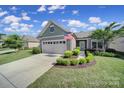 Inviting single-story home with well-maintained landscaping, two-car garage, and a charming entryway at 2364 Delaney Dr, Fort Mill, SC 29715