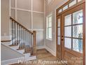Welcoming foyer with a staircase, wood flooring, and a beautiful front door with glass panels at 3439 Stags Leap Way, York, SC 29745