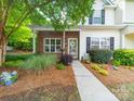 Charming home with brick accents, lush landscaping, and a welcoming walkway at 3446 Broadwick St, Charlotte, NC 28213