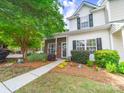 Charming two-story home with landscaped yard, brick accents, and inviting walkway at 3446 Broadwick St, Charlotte, NC 28213