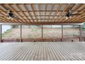 Spacious covered patio featuring a wooden floor, metal ceiling and a panoramic view of the backyard at 392 Winecoff Woods Nw Dr, Concord, NC 28027