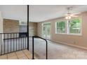 Bright living room featuring a brick fireplace and glass doors leading to the backyard at 467 16Th Nw Ave, Hickory, NC 28601
