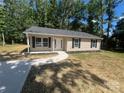 Exterior front of home with manicured lawn and landscaping at 507 Putter Pl, Chester, SC 29706