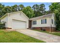 Well-maintained single-story home with attached garage and green shutters at 5359 Lake Glenn Dr, Stanfield, NC 28163