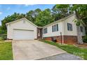 Well-maintained single-story home with attached garage and pristine landscaping at 5359 Lake Glenn Dr, Stanfield, NC 28163