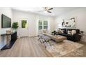 Inviting living room boasting a cozy seating area with lots of natural light and modern decor at 6 Bridge St, Lowell, NC 28098