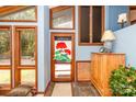 Bright foyer with large windows, a cozy rug, and a 'welcome' door decoration, creating a warm and inviting entrance at 6119 Bittersweet Ln, Charlotte, NC 28270