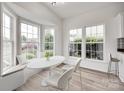 Sunlit breakfast nook with a built in bench and large windows at 622 Bayou Cir, Clover, SC 29710