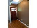 Inviting foyer features hardwood floors and a solid wood front door at 715 Gentry Pl, Charlotte, NC 28210