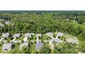 Aerial view of neighborhood with mature trees behind the homes, showcasing its peaceful, verdant location at 8840 Mullis Forest Ct, Mint Hill, NC 28227