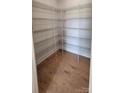 Walk-in closet featuring wood floors and wire shelving for ample storage at 885 Regulus Ct # 42, York, SC 29745