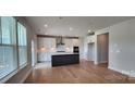 Spacious kitchen with stainless steel appliances, a center island, and wood flooring at 885 Regulus Ct # 42, York, SC 29745