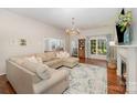 Cozy living room with a sectional sofa, fireplace, and natural light at 105 Banksridge Rd, Fort Mill, SC 29715