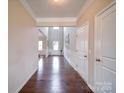 Long hallway with hardwood floors leading to the foyer at 114 Sierra Chase Dr, Statesville, NC 28677