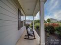 Inviting porch with rocking chairs and decorative pillows at 114 Sierra Chase Dr, Statesville, NC 28677
