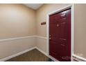 Condo interior featuring a solid wood front door with an ornate knocker and digital lock at 17111 Doe Valley Ct, Cornelius, NC 28031