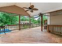 Spacious wooden deck with ceiling fan, perfect for outdoor entertaining and relaxation at 1724 Windy Rush Ln, Gastonia, NC 28054
