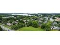 An aerial view of the neighborhood, showcasing lush green trees, bodies of water, and well-maintained lawns at 18460 W Catawba Ave, Cornelius, NC 28031