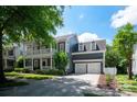 Lovely two-story home boasts an attached two-car garage and beautiful landscaping at 189 Mills Ln, Fort Mill, SC 29708