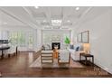 Bright living room boasts coffered ceilings, fireplace, and stylish decor at 2185 Loire Valley Dr, Fort Mill, SC 29707
