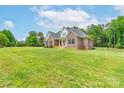 Spacious front yard leading to a well-maintained brick home with a welcoming front porch at 3178 Newcastle Dr # 42, Rock Hill, SC 29732