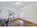 Bright room with hardwood floors, built-in shelving and a view of the outside at 436 Third Baxter St, Fort Mill, SC 29708