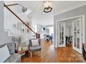 Bright foyer with hardwood floors, staircase, and access to dining and living areas at 436 Third Baxter St, Fort Mill, SC 29708