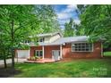Lovely brick home featuring a two-car garage and mature trees, offering both comfort and natural beauty at 506 Richards Dr, Shelby, NC 28150