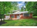 Beautiful brick home with large windows and a well-maintained front yard, creating a welcoming curb appeal at 506 Richards Dr, Shelby, NC 28150