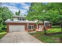 Charming two-story brick home with attached garage and lush green lawn, perfect for Gathering living at 506 Richards Dr, Shelby, NC 28150