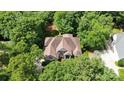 Bird's-eye view of a private residence with a multi-gable roof surrounded by mature trees and landscaping at 6795 Montgomery Rd, Lake Wylie, SC 29710