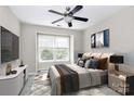 Cozy bedroom with a ceiling fan, bright window, and tastefully decorated at 7123 Meeting St, Charlotte, NC 28210