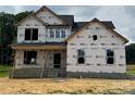 New two-story home under construction, featuring visible framing and wrapped in protective house wrap at 7513 Lancaster Hwy # 6, Waxhaw, NC 28173