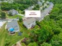 Aerial view showcases the lot lines of a home with a wooden deck and a lush, green backyard at 7650 W Berkeley Rd, Denver, NC 28037