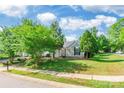 Quaint single-Gathering home boasting lush green lawn and mature trees in a serene neighborhood at 8339 Hornwood Ct, Charlotte, NC 28215
