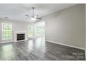 Spacious living room features a fireplace, vaulted ceiling and abundant natural light at 8339 Hornwood Ct, Charlotte, NC 28215