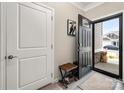 Inviting foyer features a stylish front door, coat closet, and charming decor at 9034 Evercrisp Ln, Charlotte, NC 28215