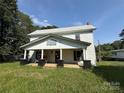 Two-story home with white siding and a covered front porch at 1445 33Rd Sw St, Hickory, NC 28602