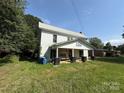 Two-story home with white siding and a covered front porch with a swing at 1445 33Rd Sw St, Hickory, NC 28602