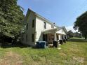 Two-story home with white siding and a covered front porch at 1445 33Rd Sw St, Hickory, NC 28602