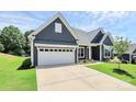 Exterior elevation showcasing beautiful home with manicured lawn at 163 Crenshaw Nw Pl, Concord, NC 28027