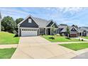 A well-maintained home with an inviting front yard and ample driveway space at 163 Crenshaw Nw Pl, Concord, NC 28027