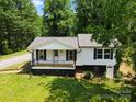 Charming home features a covered front porch, black shutters and a nicely landscaped yard at 1746 2Nd Street Sw Pl, Hickory, NC 28602