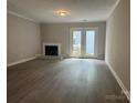 Spacious living room featuring a cozy fireplace and sliding glass doors to the backyard at 2958 Iron Gate Ln, Charlotte, NC 28212