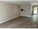 Inviting living room with neutral tones, offering seamless flow to the dining area at 2958 Iron Gate Ln, Charlotte, NC 28212