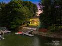 Waterfront home with deck, dock, boat lift and beautiful twilight view at 4120 Lake Shore S Rd, Denver, NC 28037