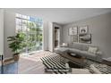 Staged living room with large windows and modern decor at 415 W 7Th St # H, Charlotte, NC 28202